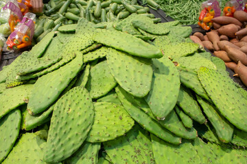 A view of a mound of fresh nopales, on display at a local grocery store.
