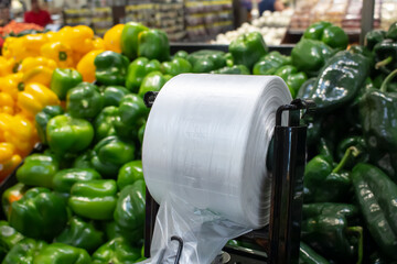 A view of a product plastic bag dispenser, seen at a local grocery store.