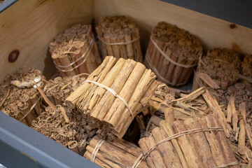 A view of several bundles of cinnamon sticks, on display at a local grocery store.