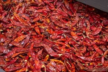 A view of a bin full of chile japones, on display at a local grocery store.