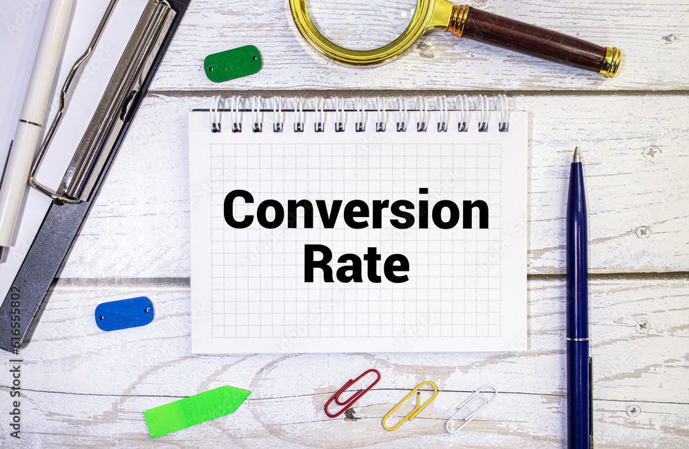Poster there is a notebook with the word conversion rate. it is eye-catching image.