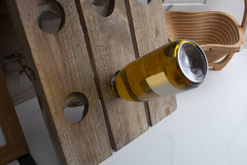 A view of a riddling rack and wine bottle.