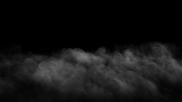Thin ground fog slowly moving forward - isolated on black background - VFX element - 4K Pro Res