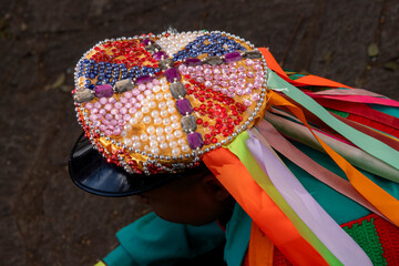 multicolored decoration on the cap and ribbons in the traditional folkloric manifestation of the congada de Santa Ifigênia on the feast of Our Lady of Rosary of Black Men. São Paulo Brazil