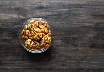 Walnut in bowl on a wood