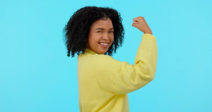 Strong, woman flex her muscles and against a green screen happy for strength. Empowerment or motivation, mockup space or power and cheerful female person pose for gender equality or achievement