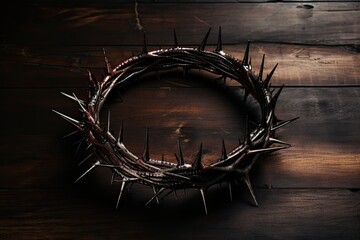 a crown of thorns on a wood surface