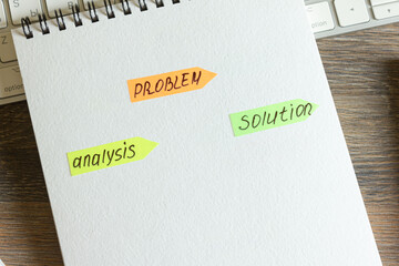 Problem, analysis, solution. Stickers with text in notepad, keyboard with pen on wooden table.