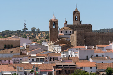 FREGENAL DE LA SIERRA, SPAIN - JUNE 26, 2022: Panoramic view of the beautiful village of Fregenal de la Sierra with its templar castle and church. HUelva, Andalicia, Spain.