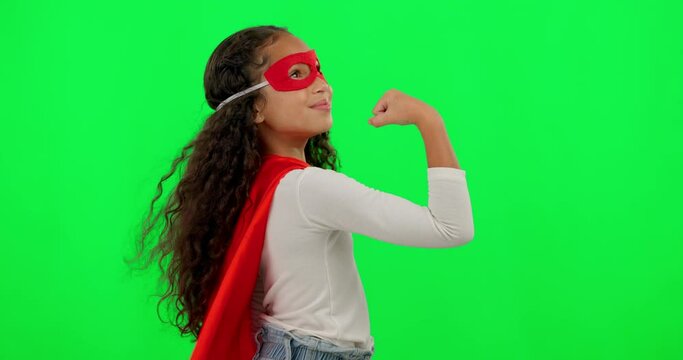 Girl child, superhero and green screen with strong arm, muscle and flex with smile on face for mockup. Young female kid, power and portrait with hero mask, red cape or stop crime by studio background