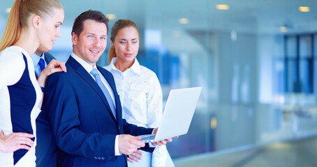 Group of business people doing presentation with laptop during meeting. Group of business people