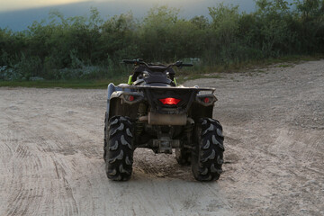 Modern fast quad bike on pathway outdoors