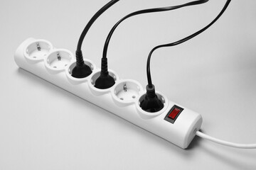 Power strip with electrical plugs on white background