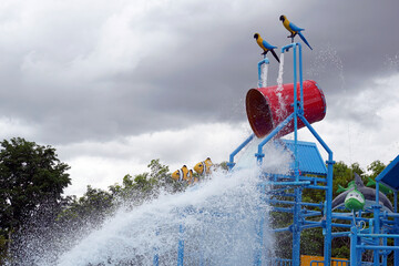 The giant water bucket is one of the most popular rides in the water park. Players will wait under the water tank for the water tank to fill up and fall over and splash out on everyone happily. © Aoy_Charin