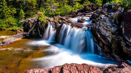 Long Exposure photo of the Redrock Falls in the Many Glaciers section of Glacier National Park in...