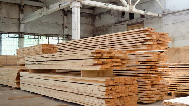 Wooden boards, lumber, industrial wood, timber. Pine wood timber. Modular prefabricated houses concept