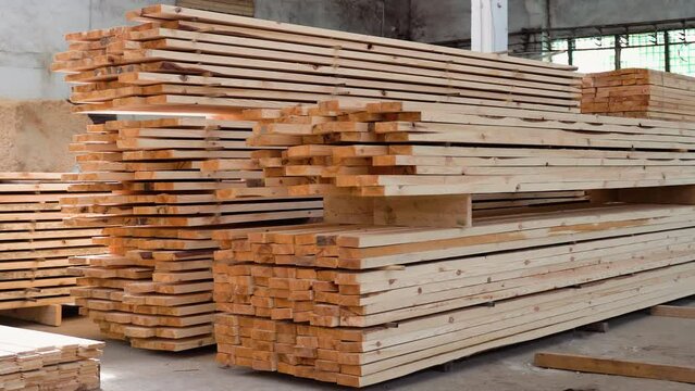 Fresh wooden slabs at the lumber storehouse. Lumber warehouse
