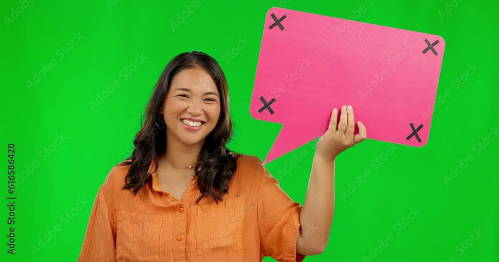 Wall mural Happy asian woman, speech bubble and question on green screen for comment against a studio background. Portrait of female person with smile and icon for feedback, social media and tracking markers