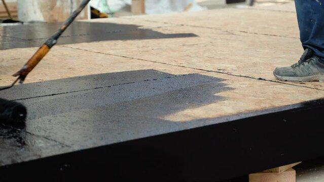 Waterproofing the floor in a private house, applying liquid resin to the floor, concrete screed and waterproofing, repair and construction work