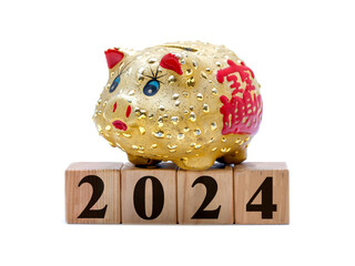 New Year 2024: piggy bank and toy blocks isolated