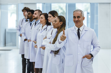 Group of experienced doctors from different of filed working together as primary healthcare team to give medical diagnosis, treatment to patients. Developing positive relationships with colleagues.