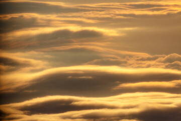 Obraz premium Abstract view to clouds from airplane on sunrise