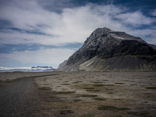landscape mountain with snow and beach sand