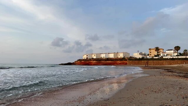 La Cala Estaca in Playa Flamenca, Orihuela Costa, Costa Blanca, Spain. A nice little beach filmed during sunrise in June.
