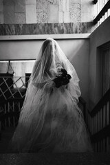 Horror scene of a scary woman in white dress in an abandoned building. Halloween scary concept