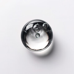 Water drops in a glass sphere on a white background