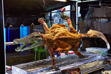 Grilled crocodile meat at traditional night market