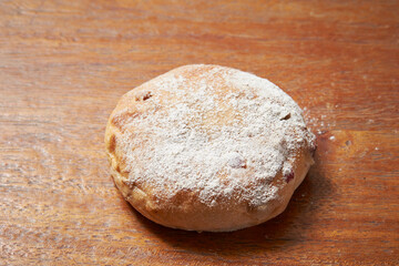 loaf of bread on wooden table