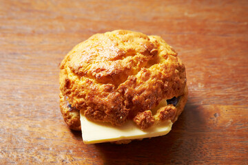 Cheese scones on wooden background