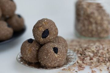 Rajamudi rice flakes laddu. Sweet balls made of roasted rajamudi rice flakes, coconut and jaggery along with cashew and almonds