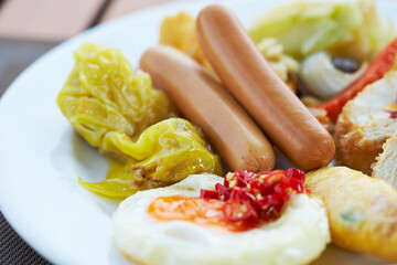Salad with Boiled Sausage and Fried Egg