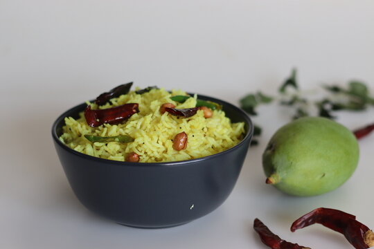 Raw mango rice shot on white background