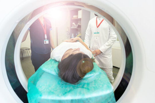 Computed tomography of the pelvis and hard tissues for women. CT scan to cure tissue diseases. Professional diagnosis of the organs of a young girl.