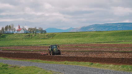 Fototapeta premium Tractor Cultivating process aerial view