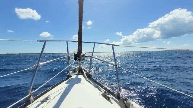 Sailing boat navigate over deep blue ocean water, pacefull jurney on summer season. 4k