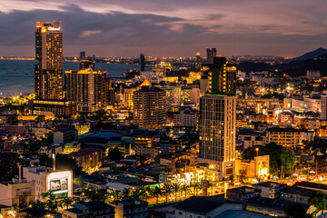 Background of Thailand's Chonburi religious attractions (Wat Khao Phra Khru viewpoint), with beautiful Buddha and Phaya Naga statues, tourists always come to make merit and take pictures at night.