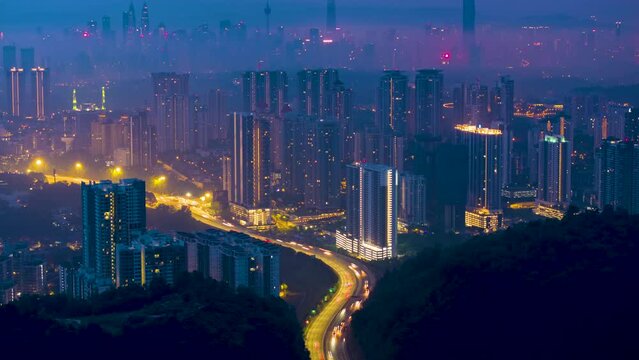 Aerial Hyperlapse of Kuala lumpur city with Luxury high rise condominium overseeing Kuala lumpur city during hazy sunrise