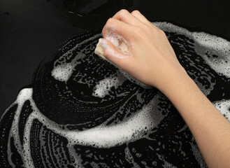 Natural Soapy Sponge with Foam, Eco Brown Sponges, Eco Friendly Hygiene Accessory on Black Background