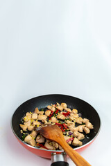 Seasoned Chicken Breast on a Frying Pan