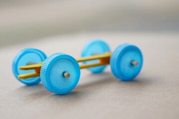 Handmade toy racing car made from ice cream sticks and bottle caps. Concept, Recycling kids toy....