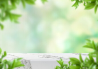Empty marble table with hanging leaves and green bokeh background for natural product presentation
