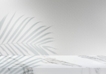 Empty white marble tabletop with leaves shadow on grey textured wall background for product presentation