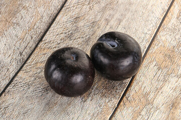 Two ripe sweet black plums