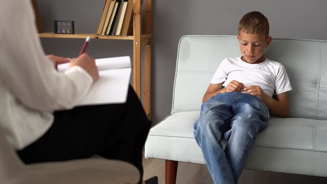 Woman child psychologist works in psychotherapy with a teenager. Children's mental health
