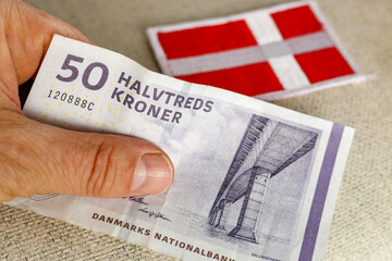 Denmark Money, 50 danish kroner banknote together with national flag, Financial and business concept
