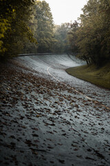 The parabolic curve of the old Monza Circuit is covered by leaves during the autumnal morning